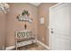 Cozy entryway with decorative bench, wall decor, and neutral-toned walls at 555 Heritage Trl, Elizabeth, CO 80107