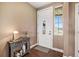 Welcoming entryway featuring stylish decor, hardwood floors, and natural light at 555 Heritage Trl, Elizabeth, CO 80107