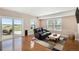 Relaxing living room with walkout sliding glass doors and neutral decor with access to outdoor patio at 555 Heritage Trl, Elizabeth, CO 80107