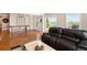 Spacious living area featuring a shuffleboard table, comfortable seating, and a sliding glass door to outdoor space at 555 Heritage Trl, Elizabeth, CO 80107