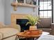 Living room detail showing fireplace and coffee table at 614 S Depew St # C, Lakewood, CO 80226