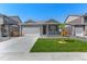 Attractive single-story home with a cozy front porch and a well-kept lawn at 13487 Valentia St, Thornton, CO 80602