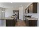 Modern kitchen with granite counters, stainless steel appliances, and ample cabinet space at 13487 Valentia St, Thornton, CO 80602