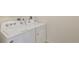 A well-lit laundry room featuring a new, white, Whirlpool washer and dryer at 13487 Valentia St, Thornton, CO 80602