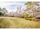 Expansive backyard featuring lush greenery, mature trees, and a large lawn for outdoor enjoyment at 6889 Frying Pan Rd, Boulder, CO 80301