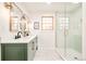 Modern bathroom featuring double vanity, updated fixtures, and a glass shower at 6889 Frying Pan Rd, Boulder, CO 80301