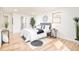 Well-lit bedroom with light wood floors, black and white decor, and a stylish rug at 6889 Frying Pan Rd, Boulder, CO 80301