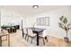 Dining room area showcasing hardwood floors and three decorative wall art pieces at 6889 Frying Pan Rd, Boulder, CO 80301