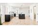 Modern kitchen with stainless steel appliances, white cabinets and a black kitchen island at 6889 Frying Pan Rd, Boulder, CO 80301