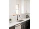 Modern kitchen sink with stainless steel fixtures and white countertops at 6889 Frying Pan Rd, Boulder, CO 80301