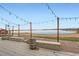 Lakeside outdoor space with wooden boardwalks, benches, and decorative barrels for a relaxing ambiance at 6889 Frying Pan Rd, Boulder, CO 80301