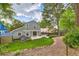 Charming home showcasing a lush backyard, including a patio, vibrant greenery, and a garden at 10360 Irving Ct, Westminster, CO 80031