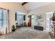Spacious bedroom with carpet floors, high vaulted ceilings, and a comfortable seating area at 10360 Irving Ct, Westminster, CO 80031