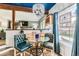 Charming dining area with glass table, stylish chairs, and views of the backyard at 10360 Irving Ct, Westminster, CO 80031