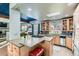 Modern kitchen with a large center island, stainless steel appliances, and an open layout at 10360 Irving Ct, Westminster, CO 80031