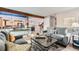 Comfortable living room showcasing an open floor plan with the kitchen and dining room visible at 10360 Irving Ct, Westminster, CO 80031