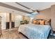 Cozy main bedroom with neutral tones, carpet, and closet, featuring a queen bed with stylish pillows at 10360 Irving Ct, Westminster, CO 80031