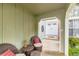 Inviting covered porch with seating area leads to the main entrance of the home at 10360 Irving Ct, Westminster, CO 80031
