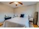 Bright bedroom features hardwood floors, ceiling fan, and modern furnishings at 6095 W 47Th Ave, Wheat Ridge, CO 80033
