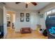 Versatile bonus room with hardwood floors, a ceiling fan, and ample natural light, ideal for various uses at 6095 W 47Th Ave, Wheat Ridge, CO 80033