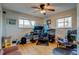 A home office with a desk, gaming chair, and ample natural light from the surrounding windows at 6095 W 47Th Ave, Wheat Ridge, CO 80033