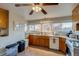 Kitchen with a large window over the sink that fills the room with natural light and wood cabinets at 6095 W 47Th Ave, Wheat Ridge, CO 80033
