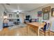 Spacious living room and dining area with hardwood floors, ceiling fan, and stylish decor at 6095 W 47Th Ave, Wheat Ridge, CO 80033