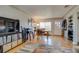 View of the living room and dining room area with hardwood floors and decor at 6095 W 47Th Ave, Wheat Ridge, CO 80033