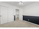 Empty bedroom with closet and access to loft at 5418 S Fundy Cir, Centennial, CO 80015