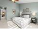 Bright bedroom with carpeted floors and large closet at 5418 S Fundy Cir, Centennial, CO 80015