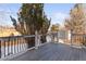 Deck overlooking the backyard with a snow-covered view at 5418 S Fundy Cir, Centennial, CO 80015