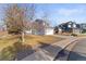 Two-story house with gray siding, attached garage, and basketball hoop at 5418 S Fundy Cir, Centennial, CO 80015