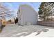 House exterior side view, showcasing gray siding and backyard at 5418 S Fundy Cir, Centennial, CO 80015