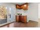 Kitchen wet bar with wood cabinets and granite countertop at 5418 S Fundy Cir, Centennial, CO 80015