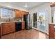 Kitchen with stainless steel appliances and access to backyard deck at 5418 S Fundy Cir, Centennial, CO 80015