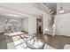 Bright living room with hardwood floors, high ceilings, and a view of the dining area at 5418 S Fundy Cir, Centennial, CO 80015