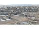 An aerial view of neighborhood homes covered in snow during the winter season at 5591 Canyon View Dr, Castle Rock, CO 80104