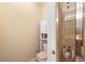 Bathroom boasts a convenient toilet with built-in storage and a glass shower with shelving for necessities at 5591 Canyon View Dr, Castle Rock, CO 80104