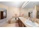 Spacious bathroom with a soaking tub, double sinks, and a large mirror at 5591 Canyon View Dr, Castle Rock, CO 80104