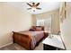 Bedroom offers neutral walls, carpet, ceiling fan, a double window, and warm decorative touches at 5591 Canyon View Dr, Castle Rock, CO 80104