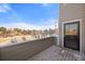 Cozy deck features a gray wood floor and siding with a lovely view of the surrounding landscape at 5591 Canyon View Dr, Castle Rock, CO 80104