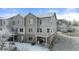 Exterior of a multi-story townhouse showcasing patios and modern design at 5591 Canyon View Dr, Castle Rock, CO 80104