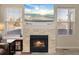 Cozy fireplace with a stone surround, offering a warm focal point in the living area for relaxation and comfort at 5591 Canyon View Dr, Castle Rock, CO 80104