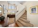 Bright foyer with high ceilings, elegant staircase, and an open view into the living area, perfect for greeting guests at 5591 Canyon View Dr, Castle Rock, CO 80104