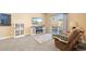 Cozy living room features a fireplace, plush carpet, and sliding glass doors to the outdoors at 5591 Canyon View Dr, Castle Rock, CO 80104