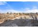 Scenic view of a field covered in light snow, surrounded by trees, and houses in the distance at 5591 Canyon View Dr, Castle Rock, CO 80104