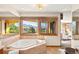 Bathroom with soaking tub featuring a view at 6 Blue Grouse Ridge Rd, Littleton, CO 80127