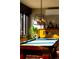 Game room with a pool table, classic piano, and a modern light fixture at 6 Blue Grouse Ridge Rd, Littleton, CO 80127