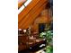 Bright indoor atrium featuring wood beams and a cozy seating area at 6 Blue Grouse Ridge Rd, Littleton, CO 80127