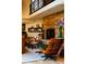 Cozy living room with a stone fireplace and stylish furniture at 6 Blue Grouse Ridge Rd, Littleton, CO 80127